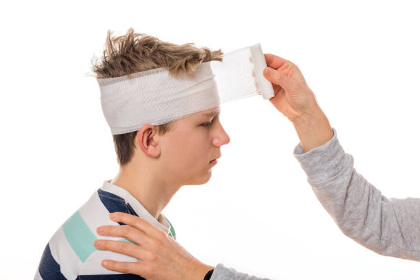 bandage on injured head of a boy after a concussion